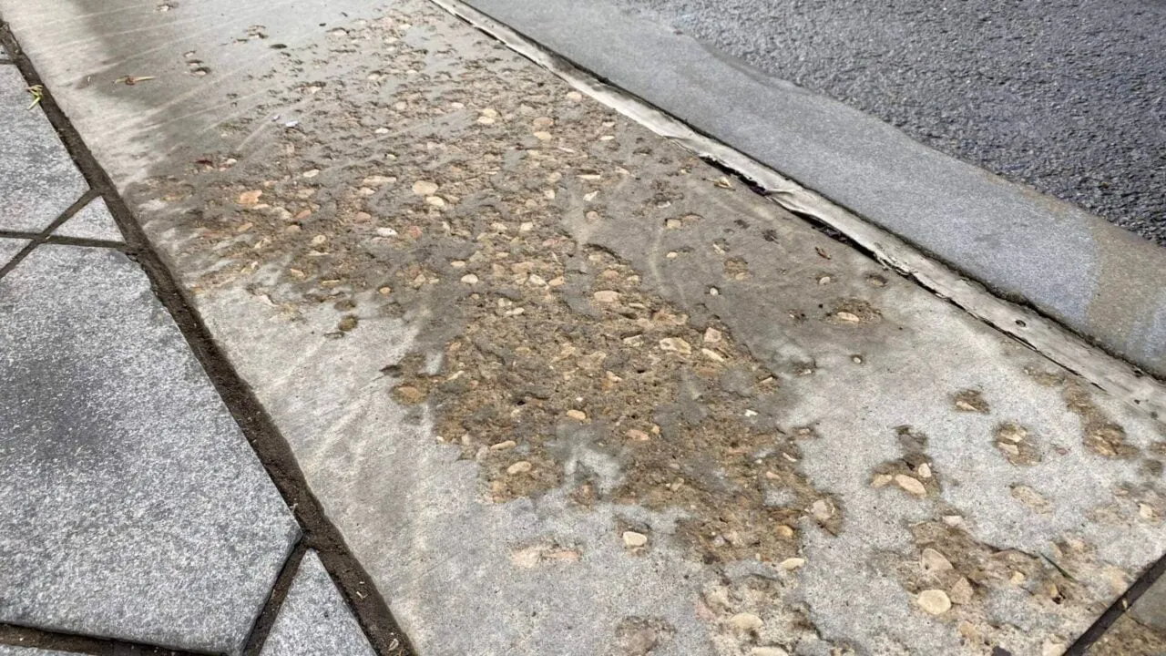 concrete spalling damage with exposed aggregate