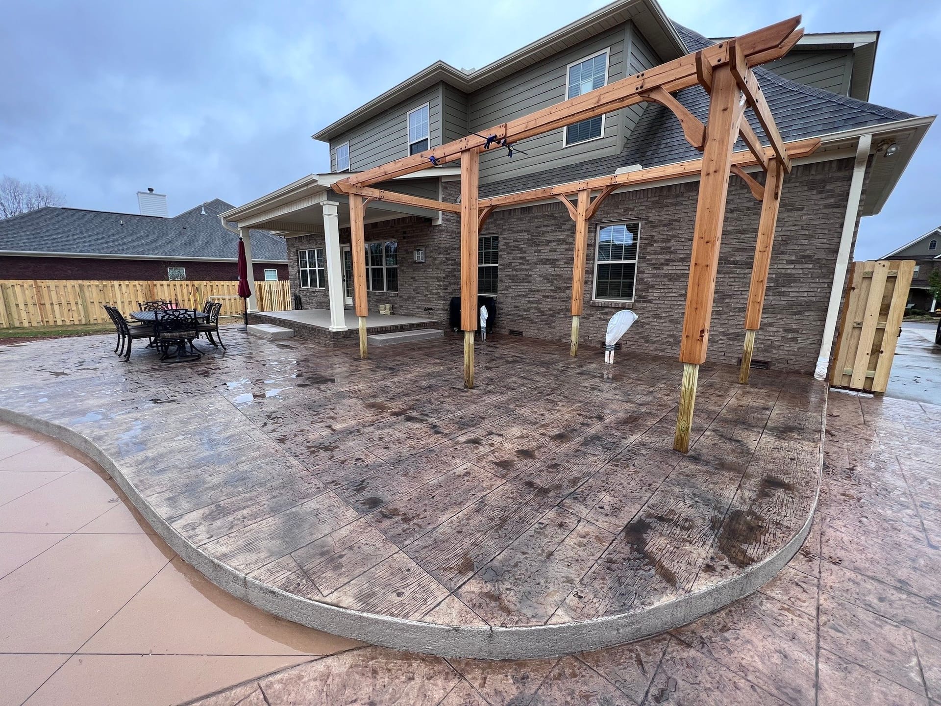 Decorative stamped concrete patio by Ken's Concrete Design